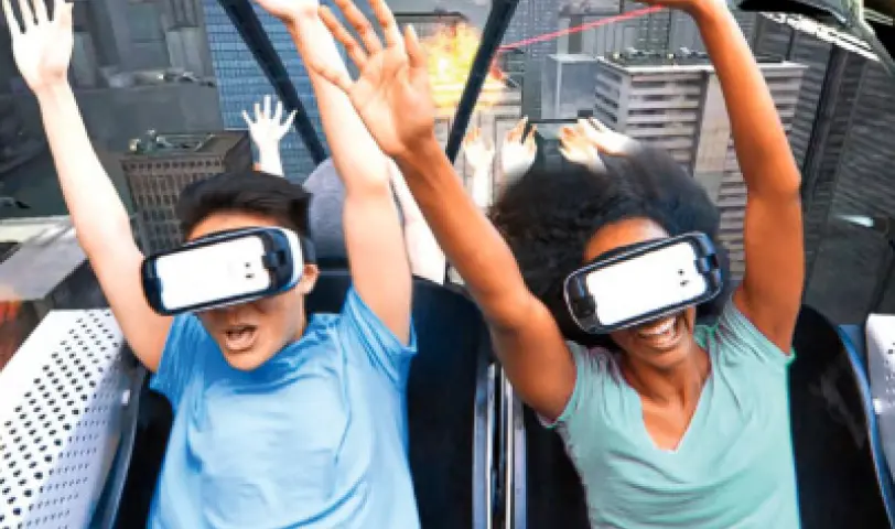 people in VR headset on a virtual roller coaster